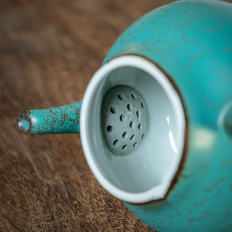 Ceramic handmade ball hole teapot kiln turned green