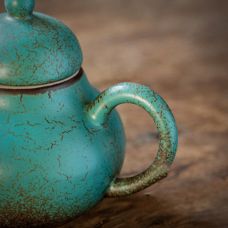 Ceramic handmade ball hole teapot kiln turned green
