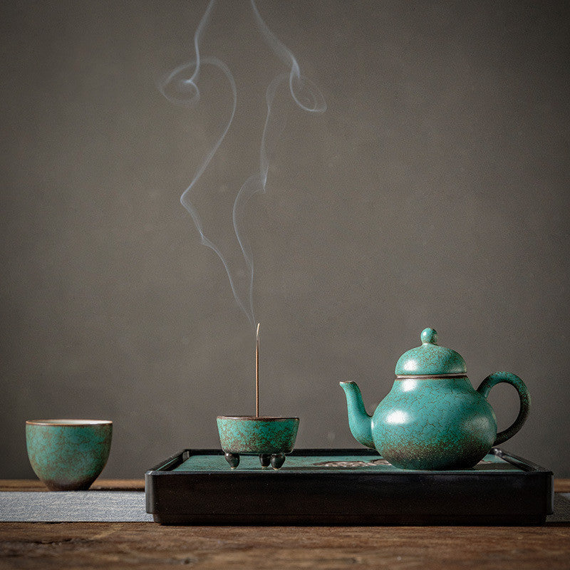 Ceramic handmade ball hole teapot kiln turned green