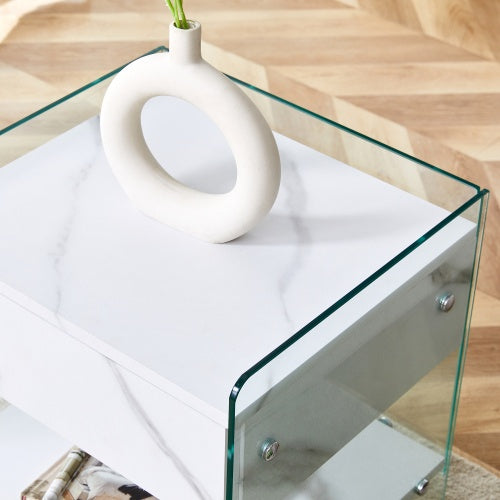 Bedside Table With Drawers. The Board Surface Is MDF Sticker, And Both Sides Are Transparent Tempered Glass. The Design Is Simple And Elegant, With Excellent Storage Functions