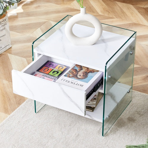 Bedside Table With Drawers. The Board Surface Is MDF Sticker, And Both Sides Are Transparent Tempered Glass. The Design Is Simple And Elegant, With Excellent Storage Functions