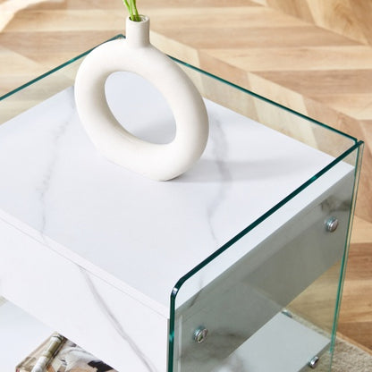 Bedside Table With Drawers. The Board Surface Is MDF Sticker, And Both Sides Are Transparent Tempered Glass. The Design Is Simple And Elegant, With Excellent Storage Functions